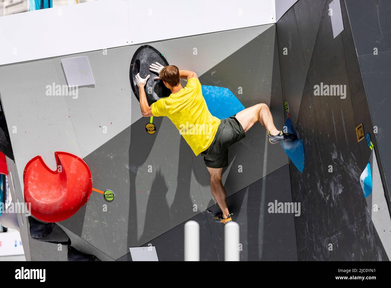 Climbing. Sport. Young person climbing in Block Climbing. Olympic exercise. Olympic Sport. Photography. Speed competition and combined. Olympic Games Stock Photo