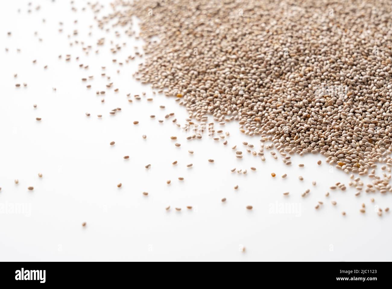 White chia seeds placed on a white background. Copy space, text space. Stock Photo