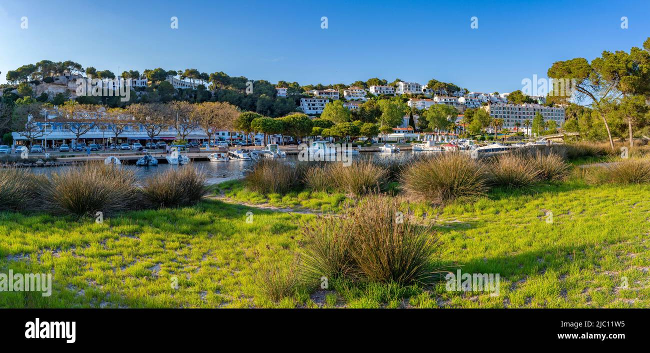 View of hotels overlooking boats at marina in Cala Galdana, Cala Galdana, Menorca, Balearic Islands, Spain, Europe Stock Photo