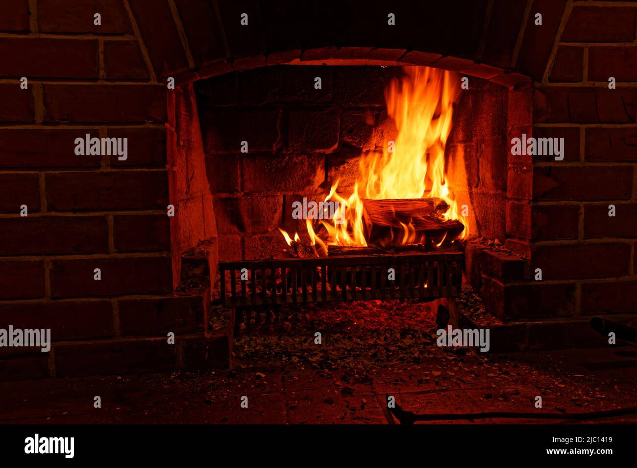 Winter warmth, an open fire burns brightly Stock Photo