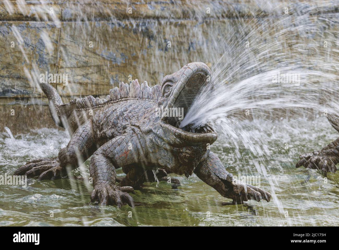 Fountain with water spouting iguana figure at Herrenchiemsee Castle, Germany, Bavaria, Lake Chiemsee Stock Photo