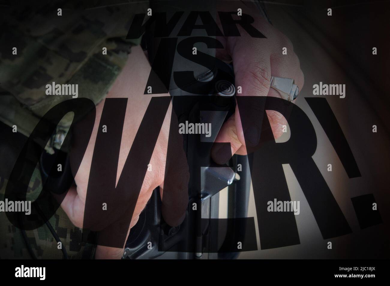 War is over writing black on soldier with gun background Stock Photo