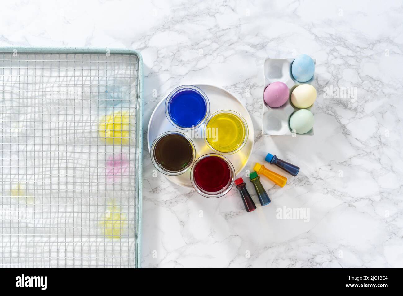 Coloring hard-boiled white eggs with natural food coloring Stock Photo