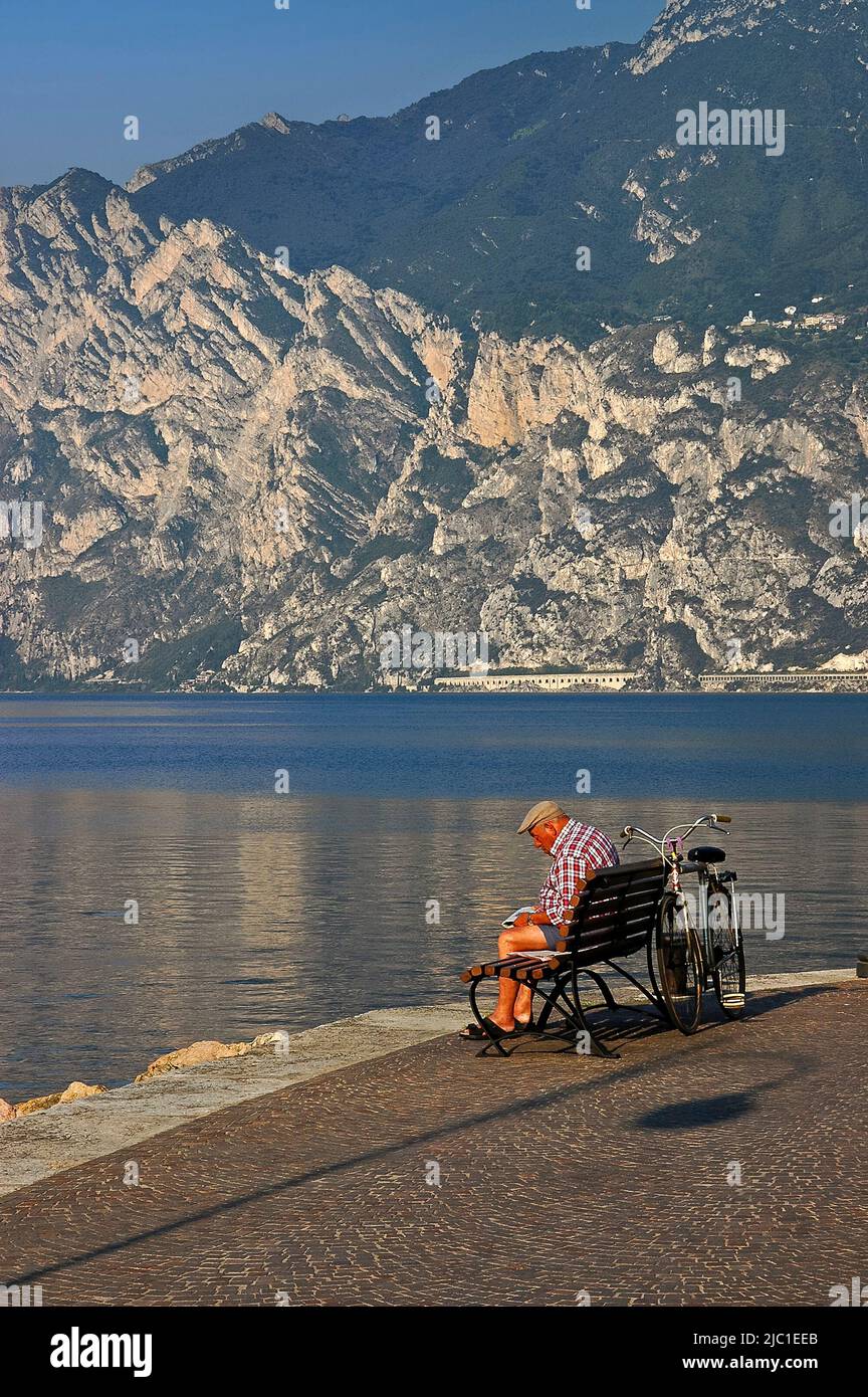 Man sitting on lake garda waterfront hi-res stock photography and ...