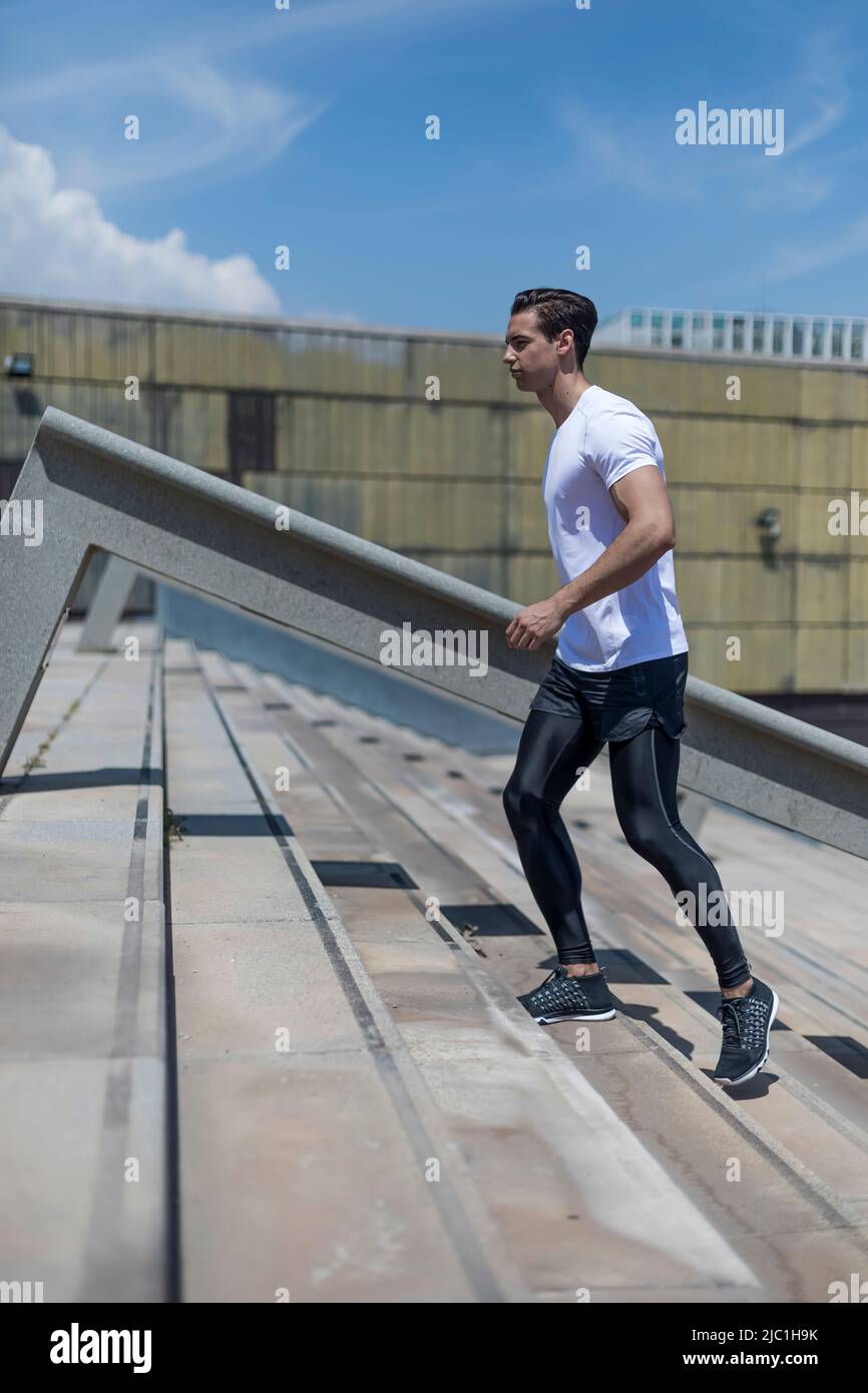 Athletic Sport Runner Man Running In Urban Training Stock Photo