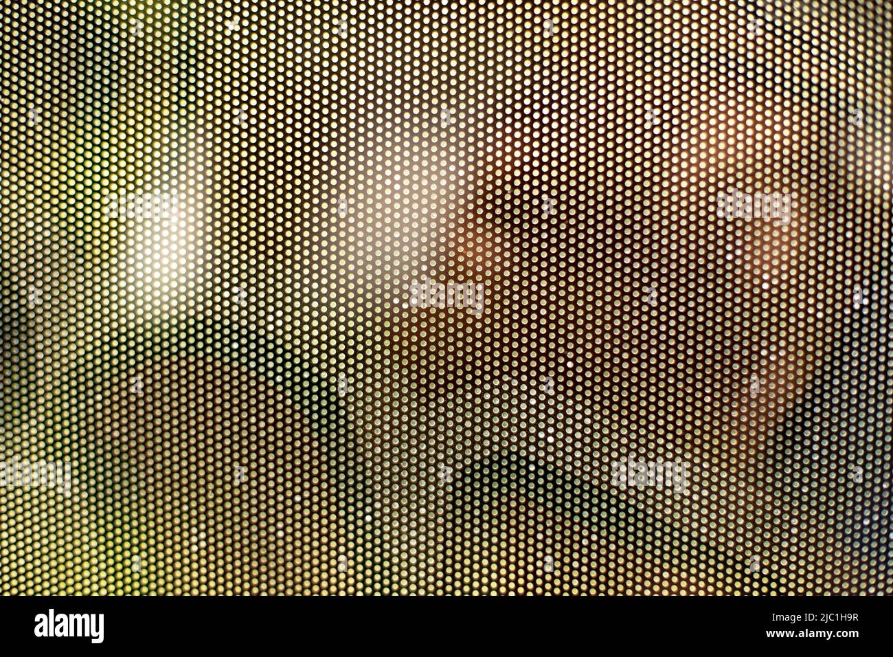 Mesh texture on glass. Shooting window. Small cage. Textured surface. Stock Photo