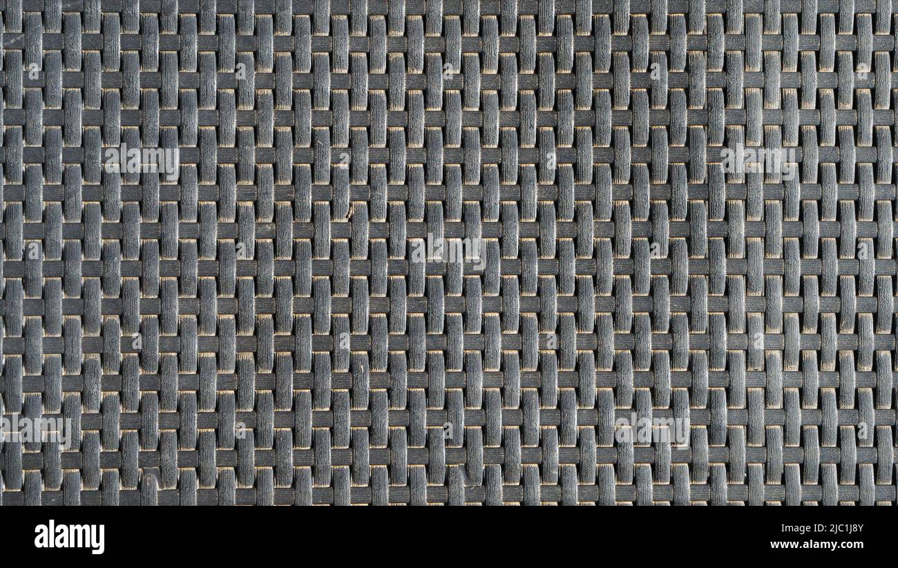 Abstract pattern background texture. Dark fabric surface texture.Textile woven macro furniture. Stock Photo