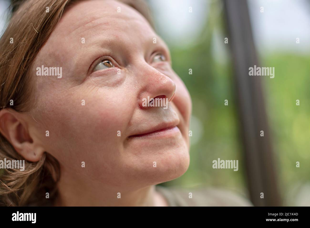 Side profile mature woman looking hi-res stock photography and images ...