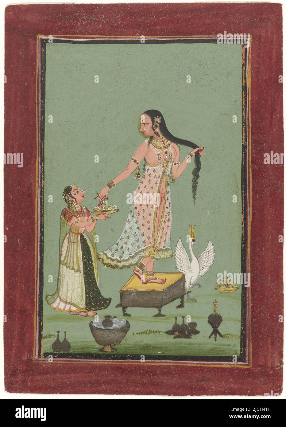 Against a simple green background in the middle stands a woman on a tabouret, in her right hand she is holding her hair, the left one reaches diagonally back in the bowl that a servant holds in front of her and in which there are jewels, behind the tabouret stands a swan with her neck stretched upwards, in the foreground and on the side some jars and bottles. Around the scene a narrow black border and some pink and yellow frame lines on a purple wide border speckled with blue, lady after bath, with servant., draughtsman: anonymous, Bundi, 1790 - 1810, paper, brush, h 240 mm × w 172 mm Stock Photo