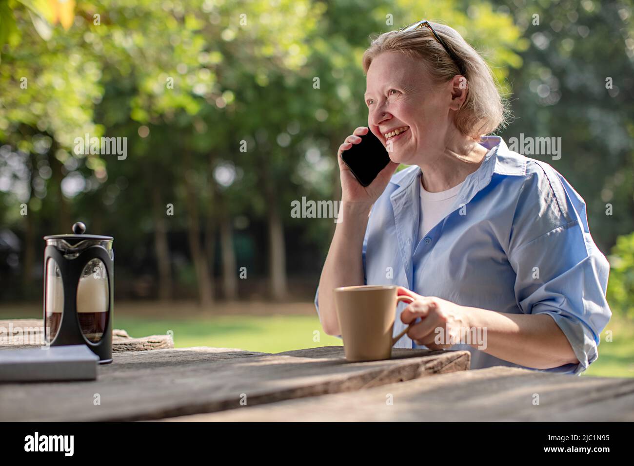 Mature adult woman talking on a mobile phone Stock Photo