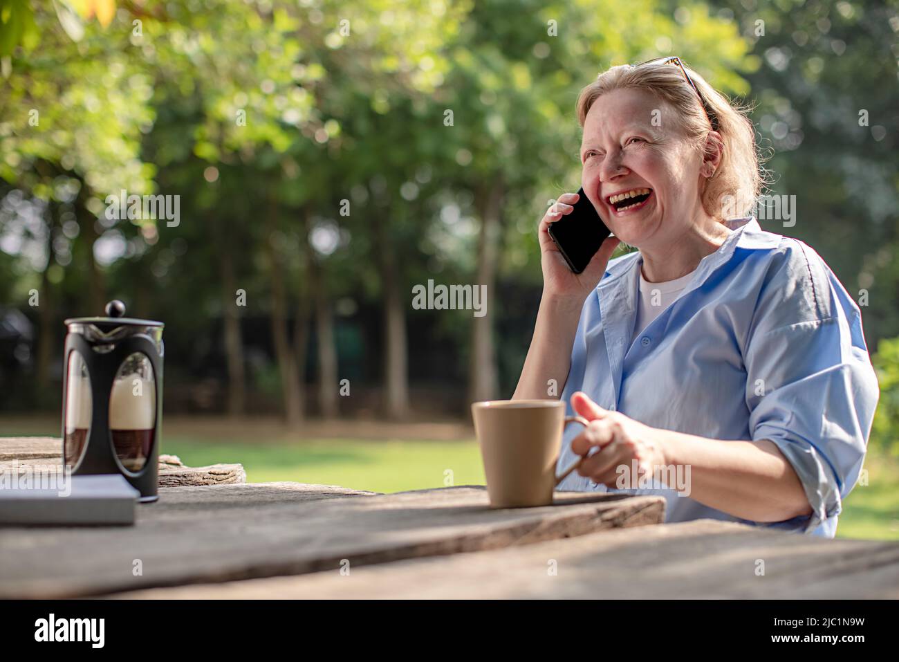 Mature adult woman talking on a mobile phone Stock Photo