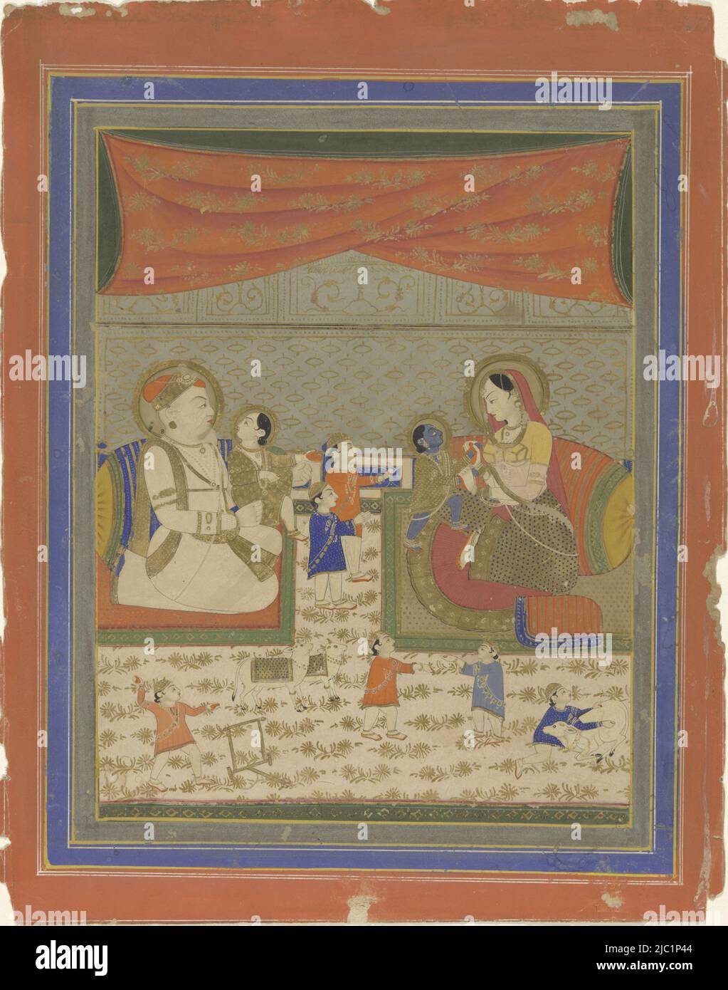 The royal couple sits in a rather geometric composition with lots of decorative textiles facing each other on colored carpets, each parent has a child on their lap and between the two rugs two children with their arms towards Krishna stand on their mother's lap, on the white carpet printed with gold motifs in the foreground four children are playing, two cows look up at Krishna and a cow serves as a toy for the child on the lower right. Around the show a number of decorative borders in plain gray with gold frame lines, royal blue with white frame lines and a wider orange-red border with gold Stock Photo