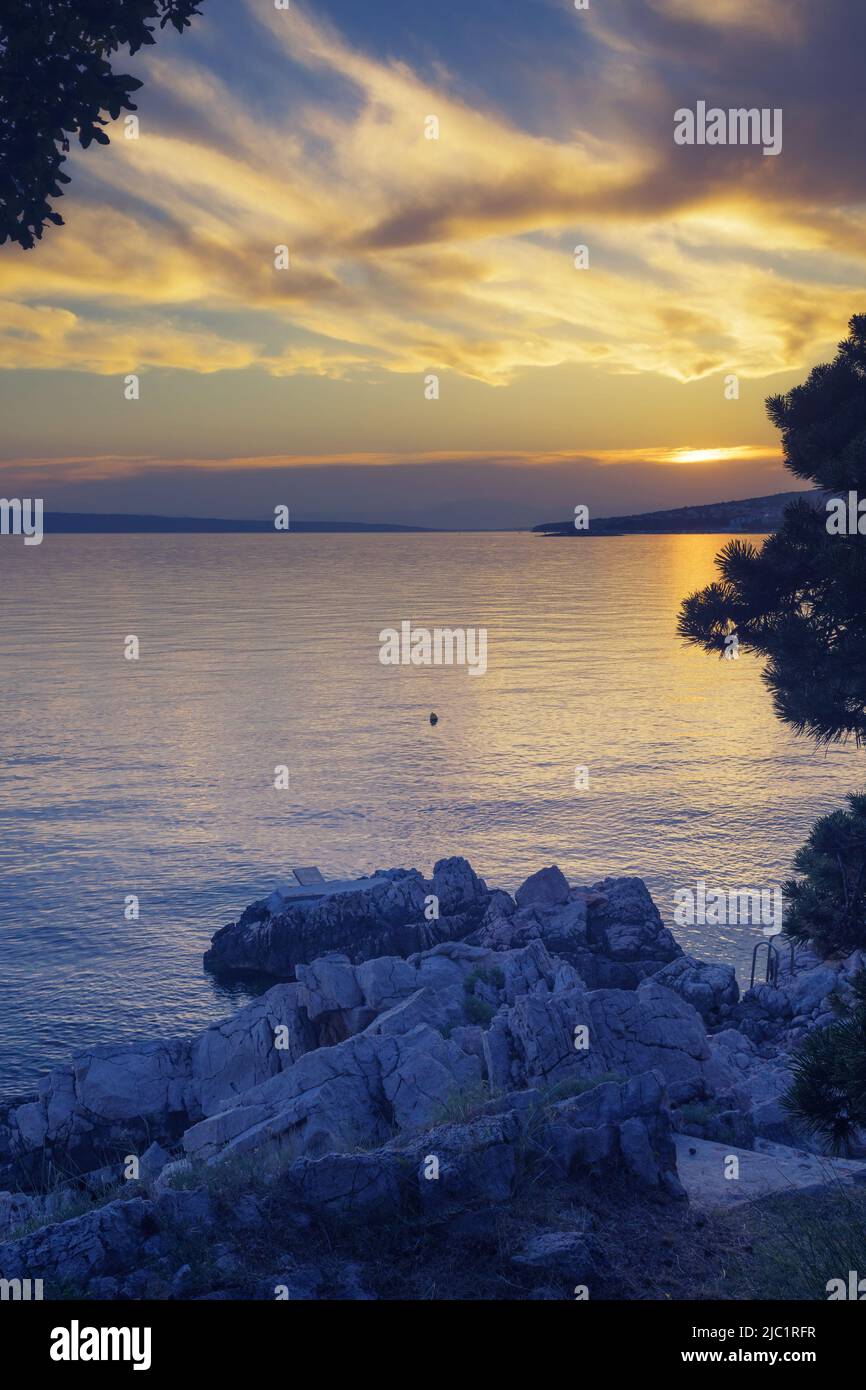 Peaceful scene at the beach of Adriatic sea with beautiful clouds at sunset time. Summer vacation, travel and tourism concepts Stock Photo