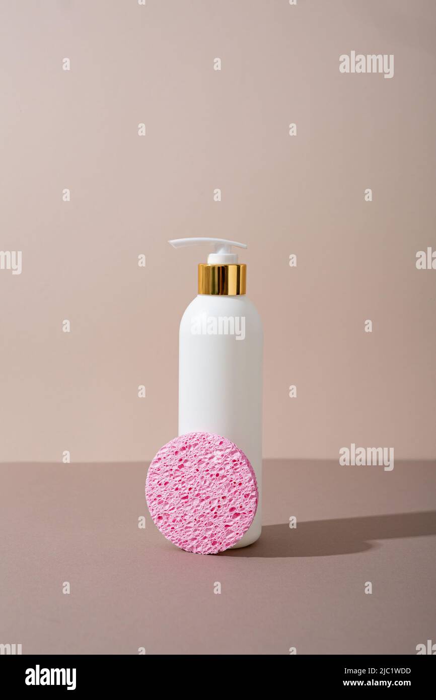 White bottle cosmetics shampoo shower gel sponge Stock Photo