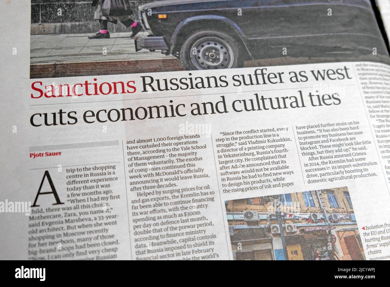 'Sanctions:  Russians suffer as west cuts economic and cultural ties' Guardian newspaper headline article 20 May 2022 London UK Stock Photo