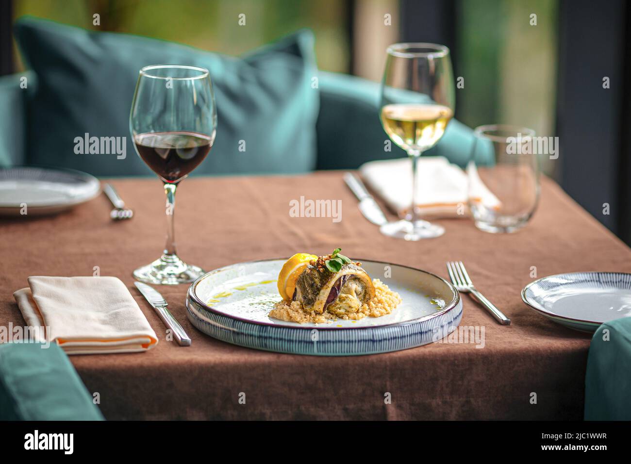Served restaurant table with drinks and food Stock Photo