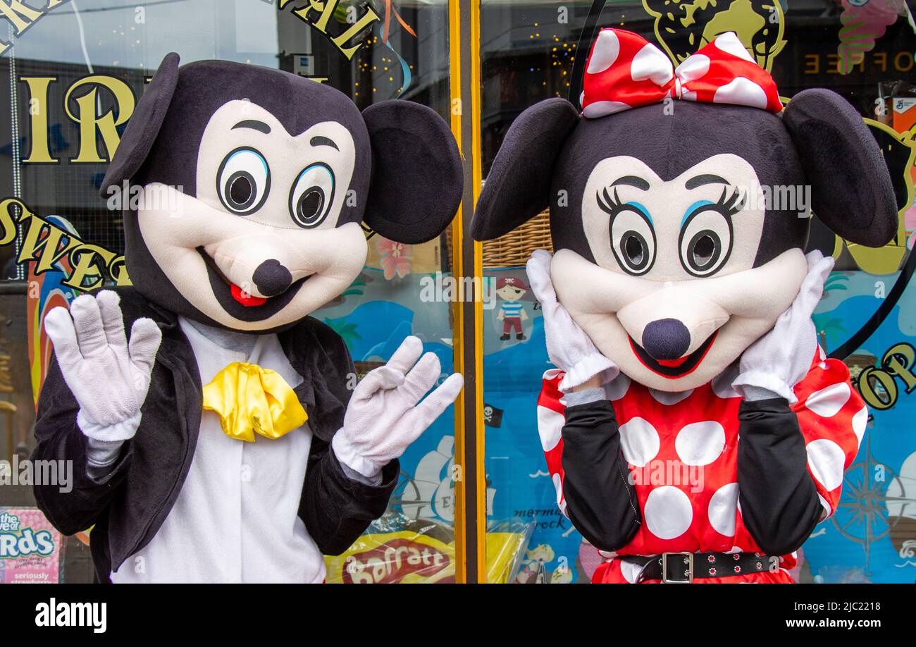 People dressed up in Disney Character costumes Stock Photo