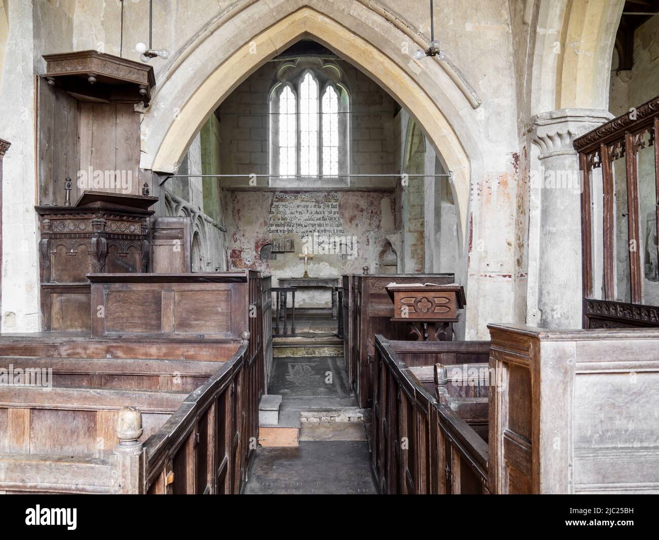 Interior shot of St. John The Baptist church at Inglesham, Wiltshire, an ancient unmodernised small church near the River Thames at Lechlade. Stock Photo