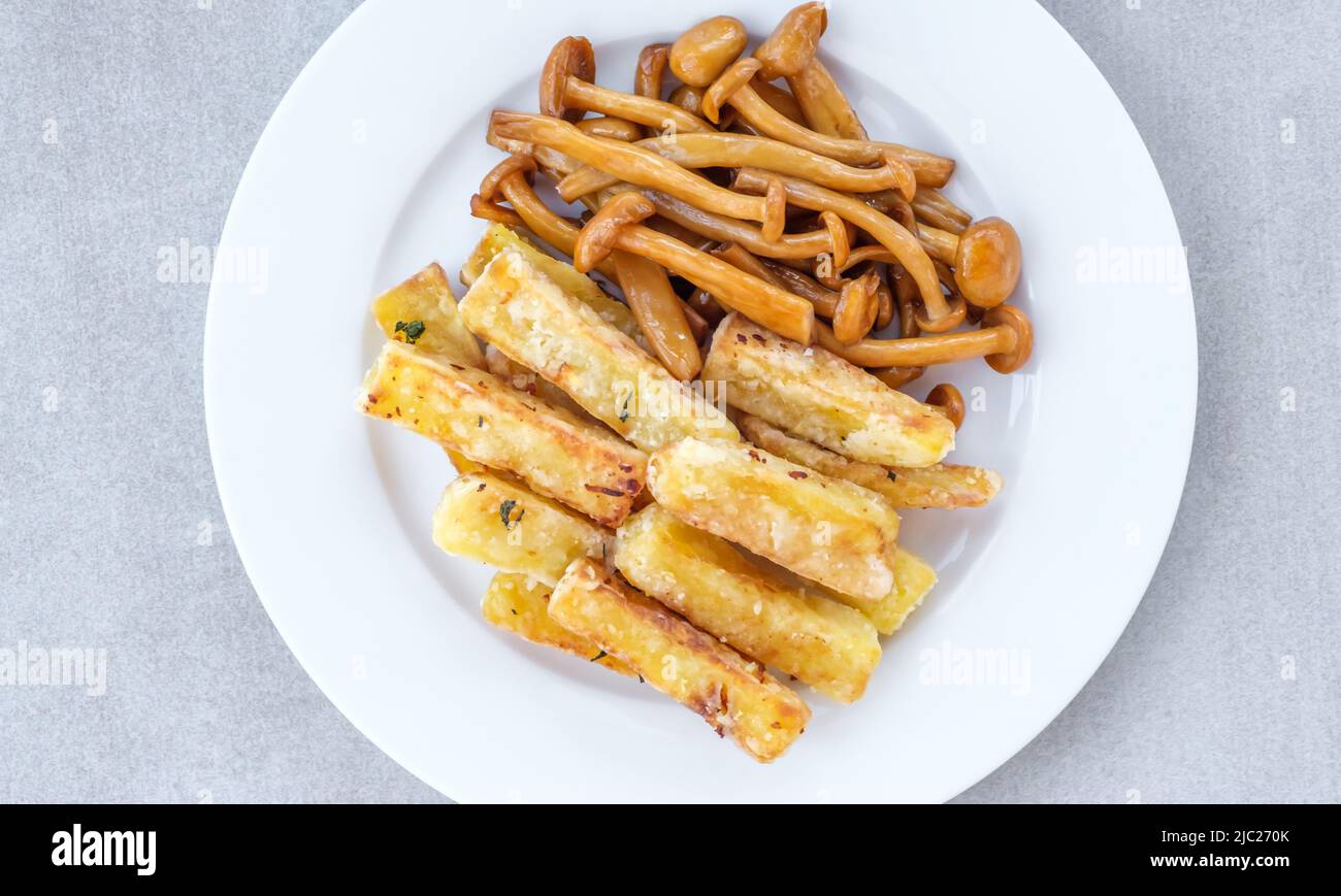 French fries with soy sauce shimeji mushrooms Stock Photo Alamy