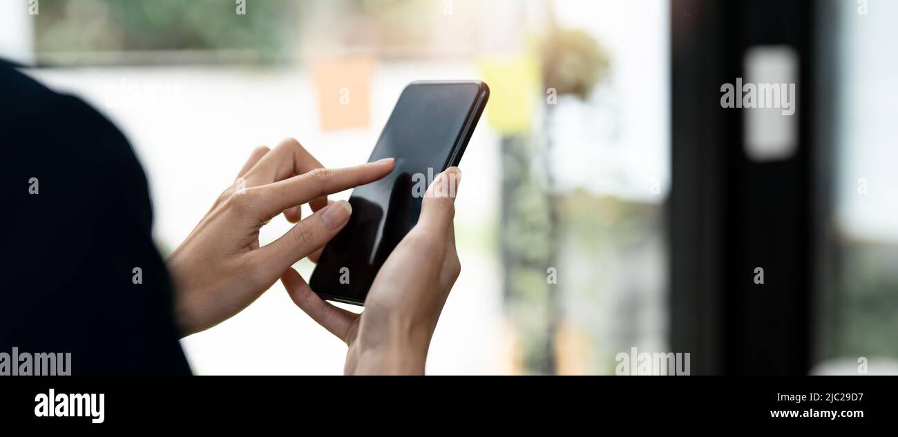point finger on screen phone closeup, person texting text message, hipster touch on screen on smartphone, girls using in hands mobile phone close up Stock Photo