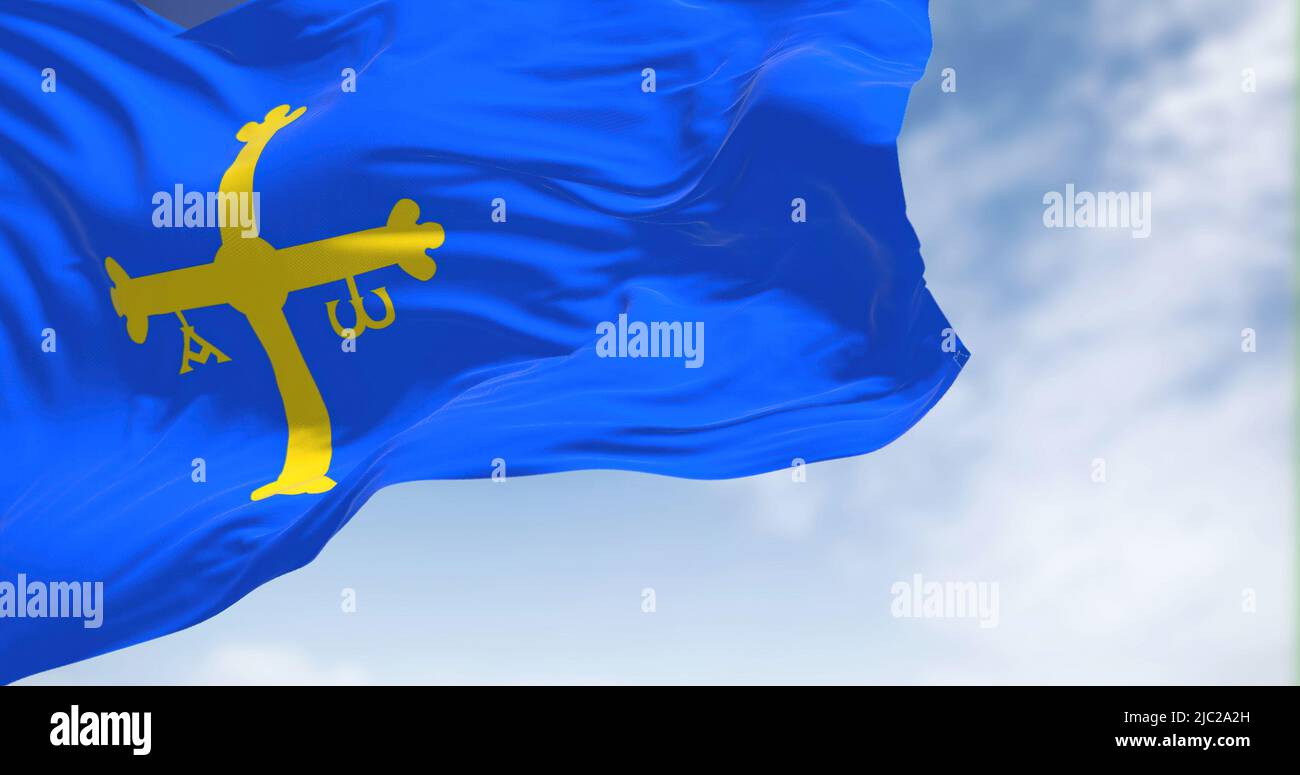 Asturias flag waving in the wind on a clear day. Asturias is an autonomous community in northwest Spain Stock Photo
