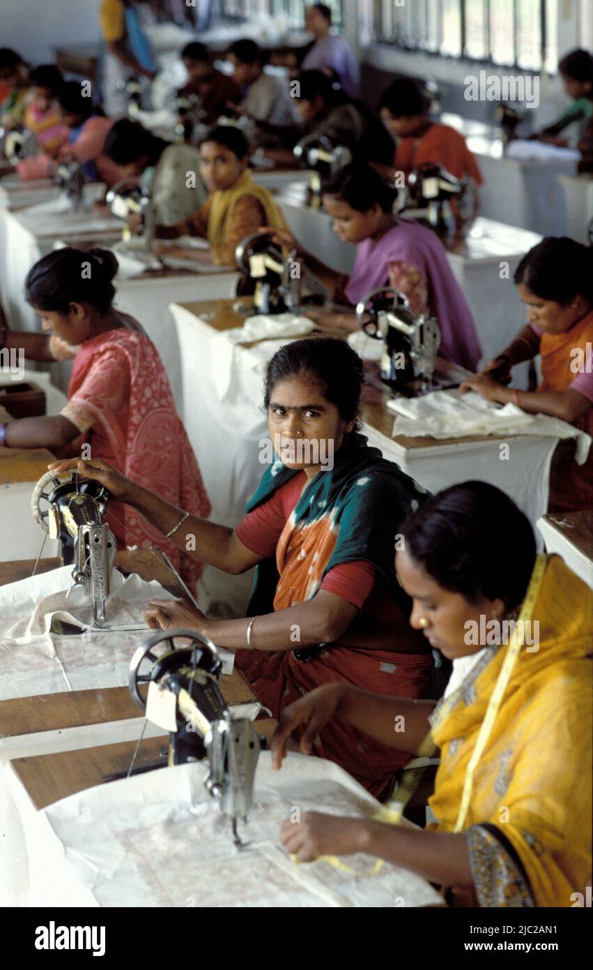 Bangladesh; portrait of a woman working with a sewing machine. Textile factory. Stock Photo