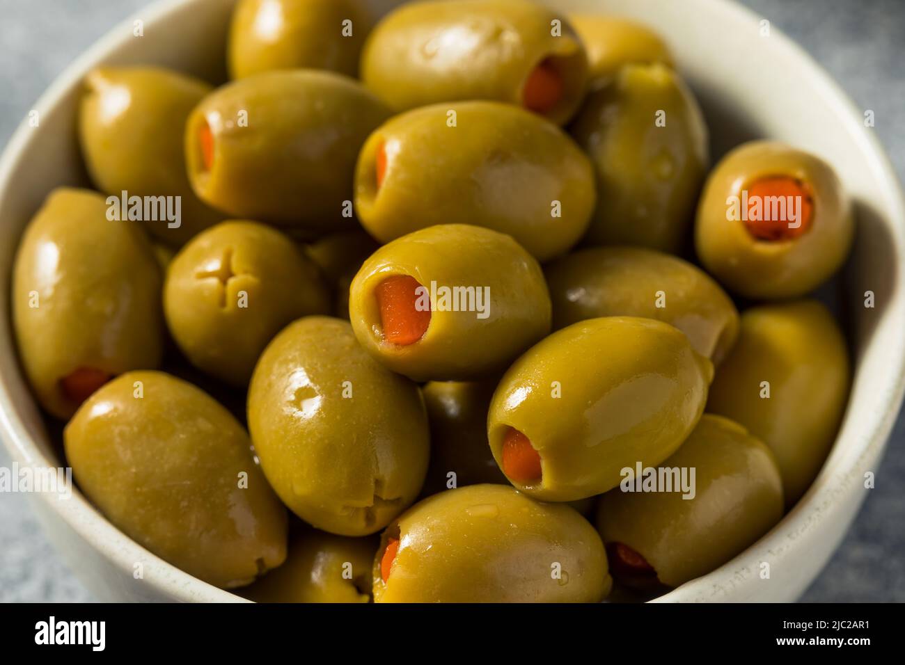 Raw Marinated Organic Green Olives with Pimento Peppers Stock Photo Alamy