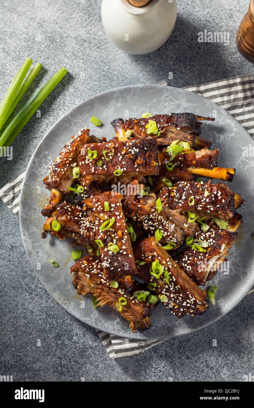 Homemade Spicy Asian Baby Back Ribs with Sesame and Green Onions Stock
