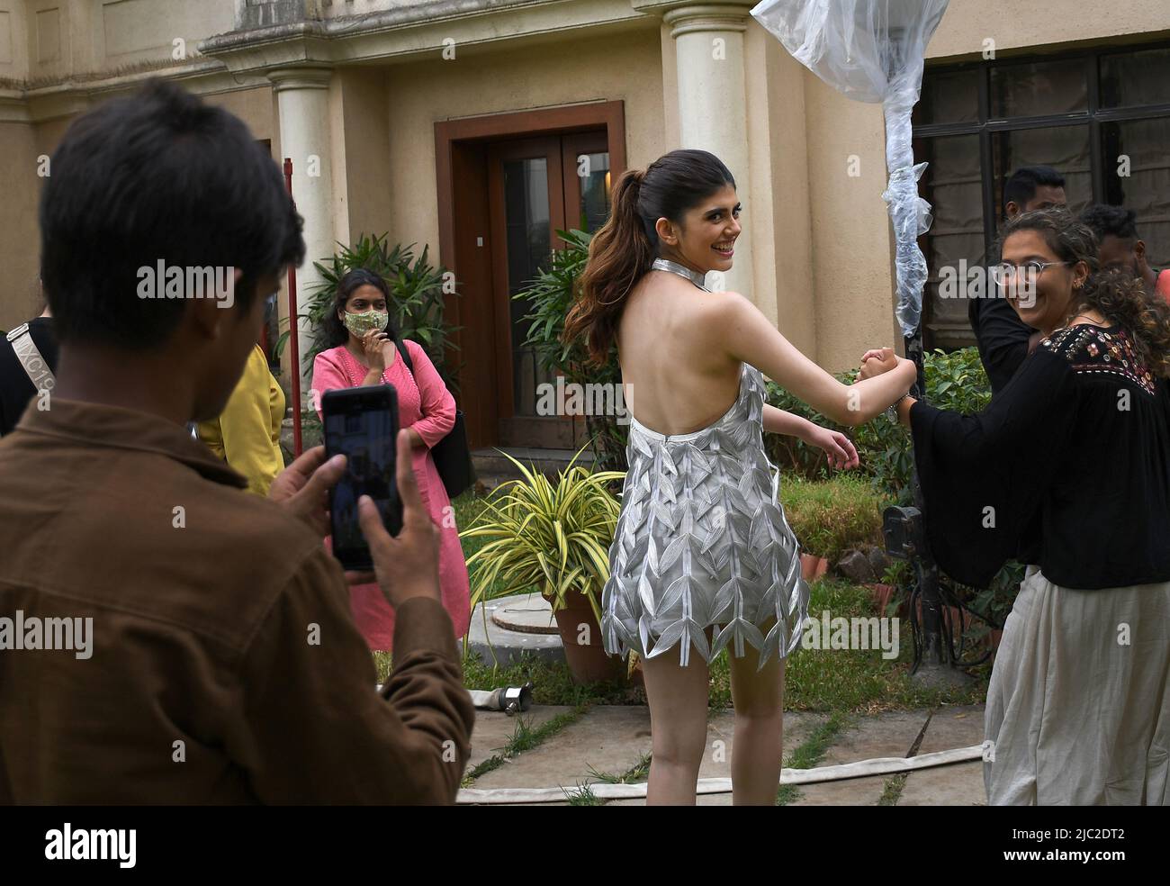 Mumbai, India. 09th June, 2022. Bollywood actress Sanjana Sanghi looks back as she is escorted by a woman during a promotional event of her upcoming film 'Om-The Battle Within' in Mumbai. The film will released on 1st July 2022. Credit: SOPA Images Limited/Alamy Live News Stock Photo