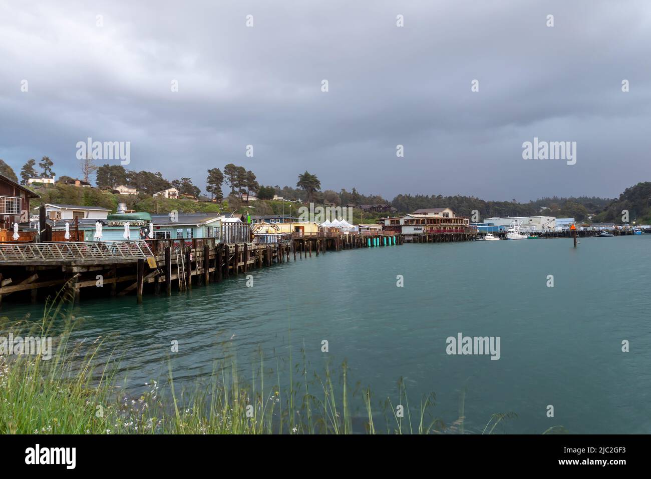 Fort Bragg, California, May 8, 2022.  Harbor area on mothers’ day, featuring restaurants, the ocean and a cloudy sky in the evening Stock Photo