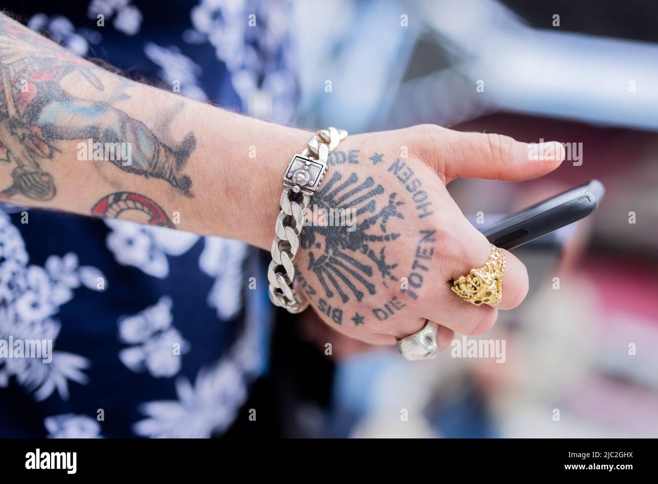 Cologne, Germany. 09th June, 2022. Patrick Orth, managing director of the  record company JKP of the punk band "Die Toten Hosen", wears a tattoo with  the band's logo "Die Toten Hosen -