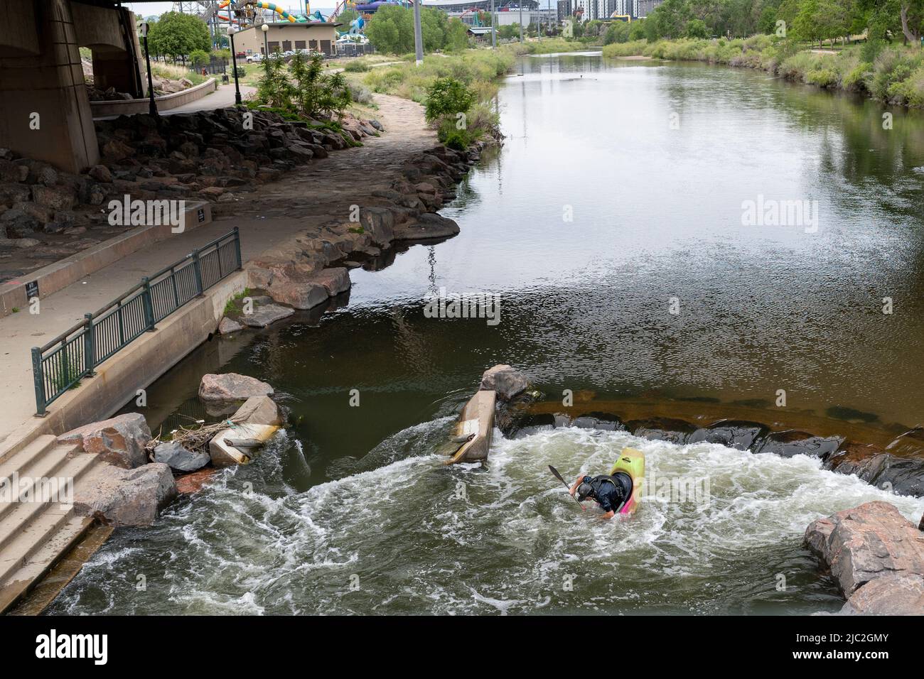 Denver, Colorado, May 28, 2022. Man kayaking in the South Platter River along the trail and near the bridge Stock Photo