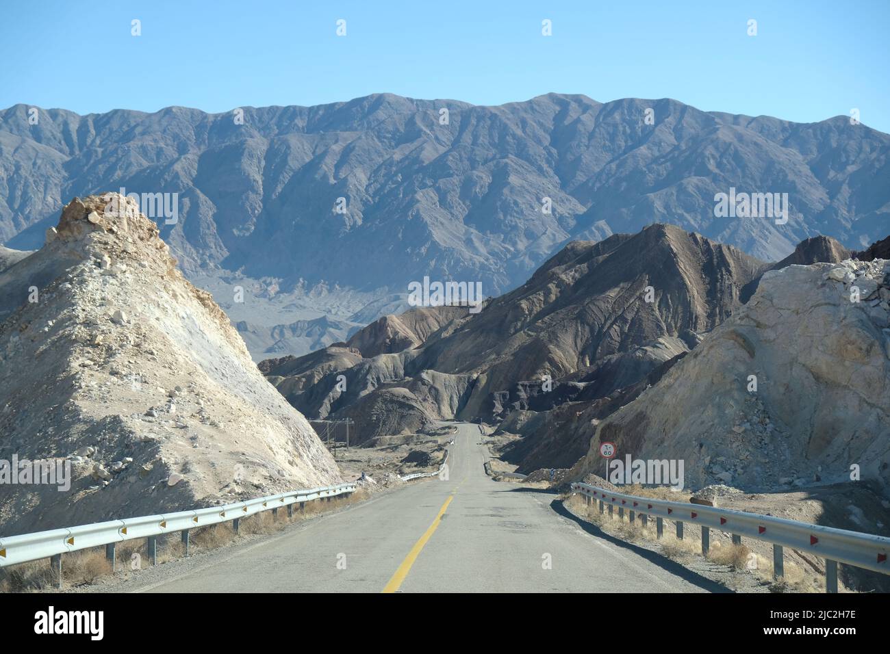 Long road cutting through mountains in Central Iran Stock Photo