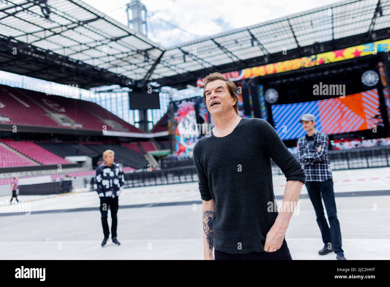 Cologne, Germany. 09th June, 2022. Campino (civil name: Andreas Frege), singer of the punk band 'Die Toten Hosen,' stands in front of the stage at the RheinEnergieStadion before the official start of the anniversary tour 'Alles aus Liebe - 40 Jahre Die Toten Hosen.' The tour starts on 10.06. in Cologne. Credit: Rolf Vennenbernd/dpa/Alamy Live News Stock Photo