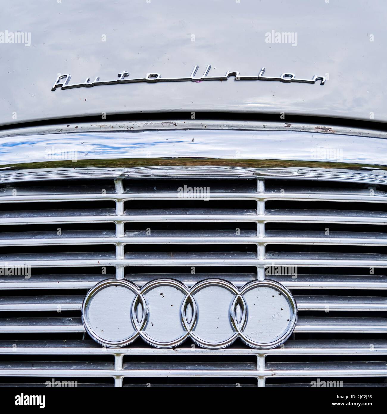 Auto Union lettering and logo of rings on the radiator grille of the classic car, the forefather of today's modern brand Audi in Hildesheim, Germany, Stock Photo