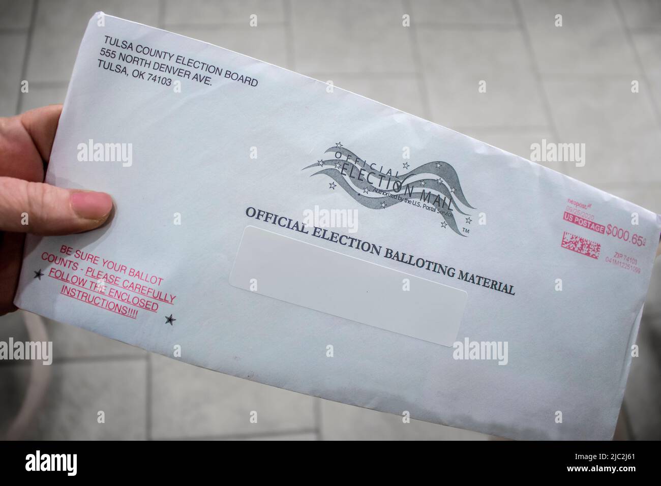 2020 10 02 Tulsa OK. Hand holding official Election Mail-in Ballot just ...