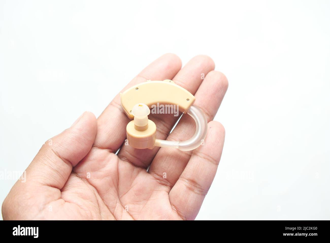 Hearing aid equipment on hand top view Stock Photo Alamy