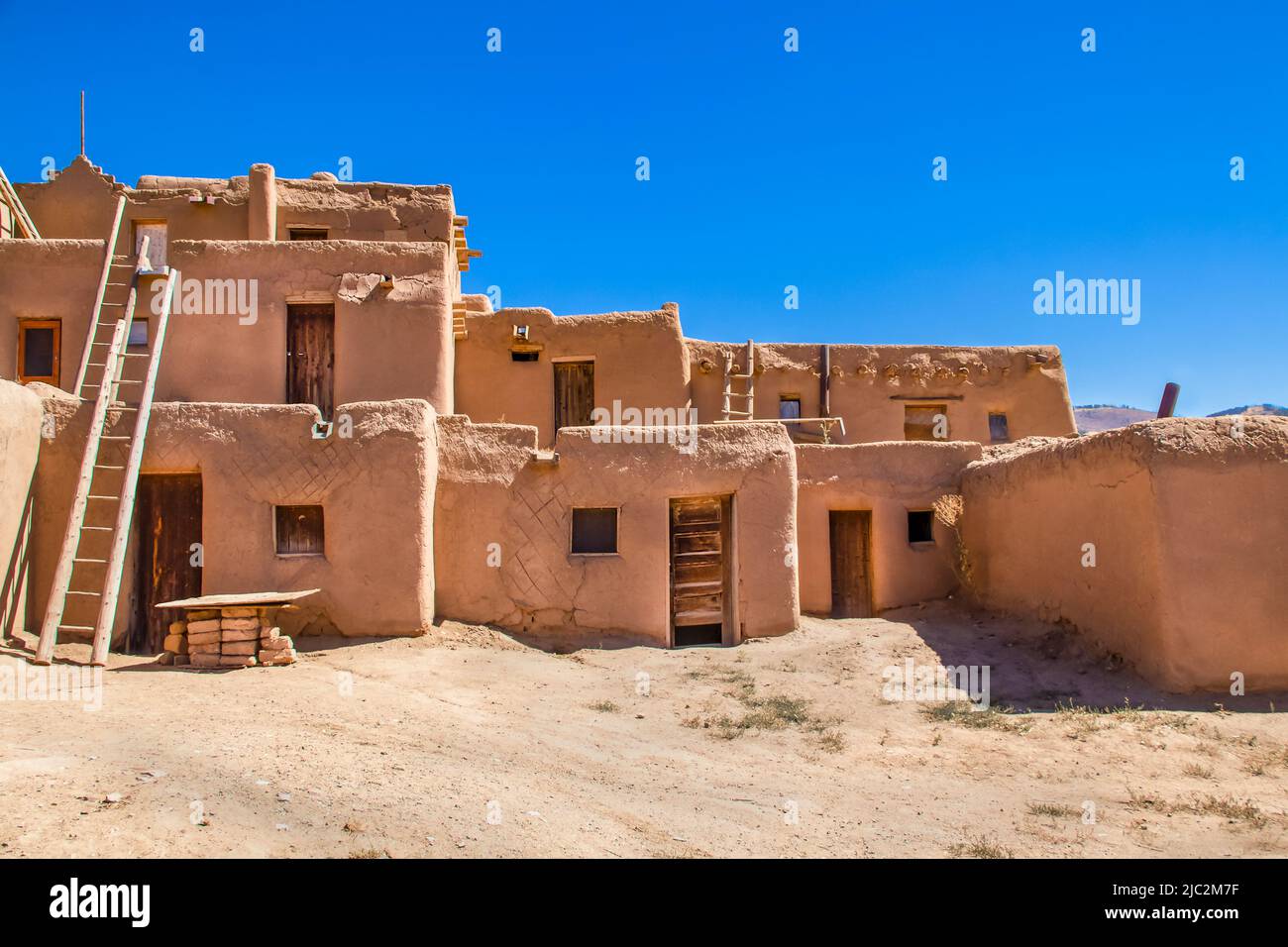 Multi-story adobe buildings from Taos Pueblo in New Mexico where Indigenous people are still living after over a thousand years Stock Photo