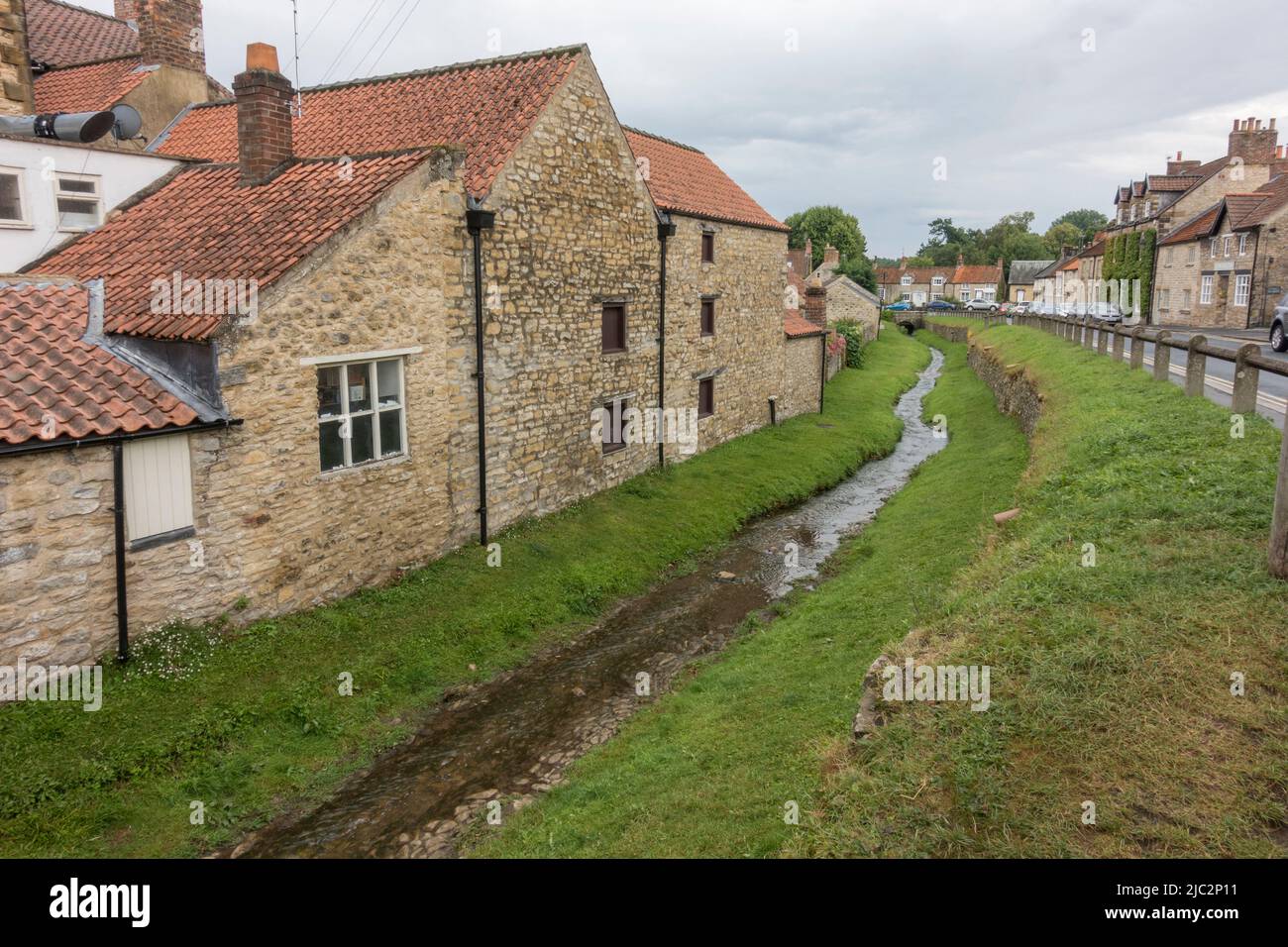 Stream running beside Castlegate in Helmsley, a market town in Ryedale, North Yorkshire, England. Stock Photo