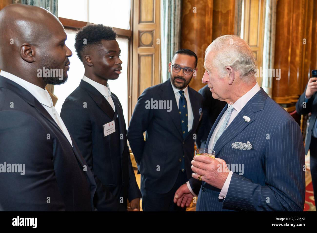 Britain's Prince Charles meets footballer Bukayo Saka, while he attends a reception celebrating the Commonwealth Diaspora of the United Kingdom, in London, Britain June 9, 2022. Dominic Lipinski/PA Wire/Pool via REUTERS Stock Photo