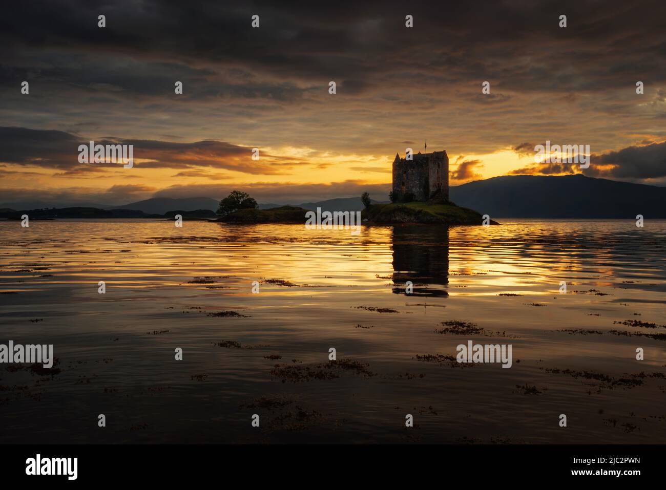 Stalker Castle in gold evening light, Highlands, Scotland Stock Photo