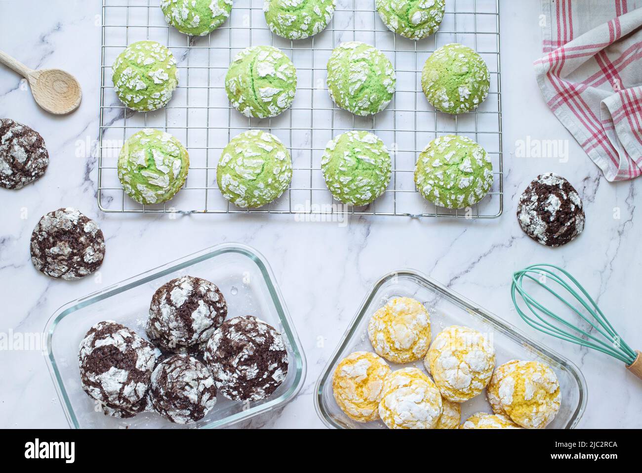Overhead view of chocolate, lemon and pistachio crinkle cookies on a cooling rack Stock Photo