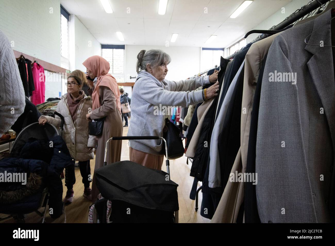 Jumble Sale, people searching through unwanted donated items and