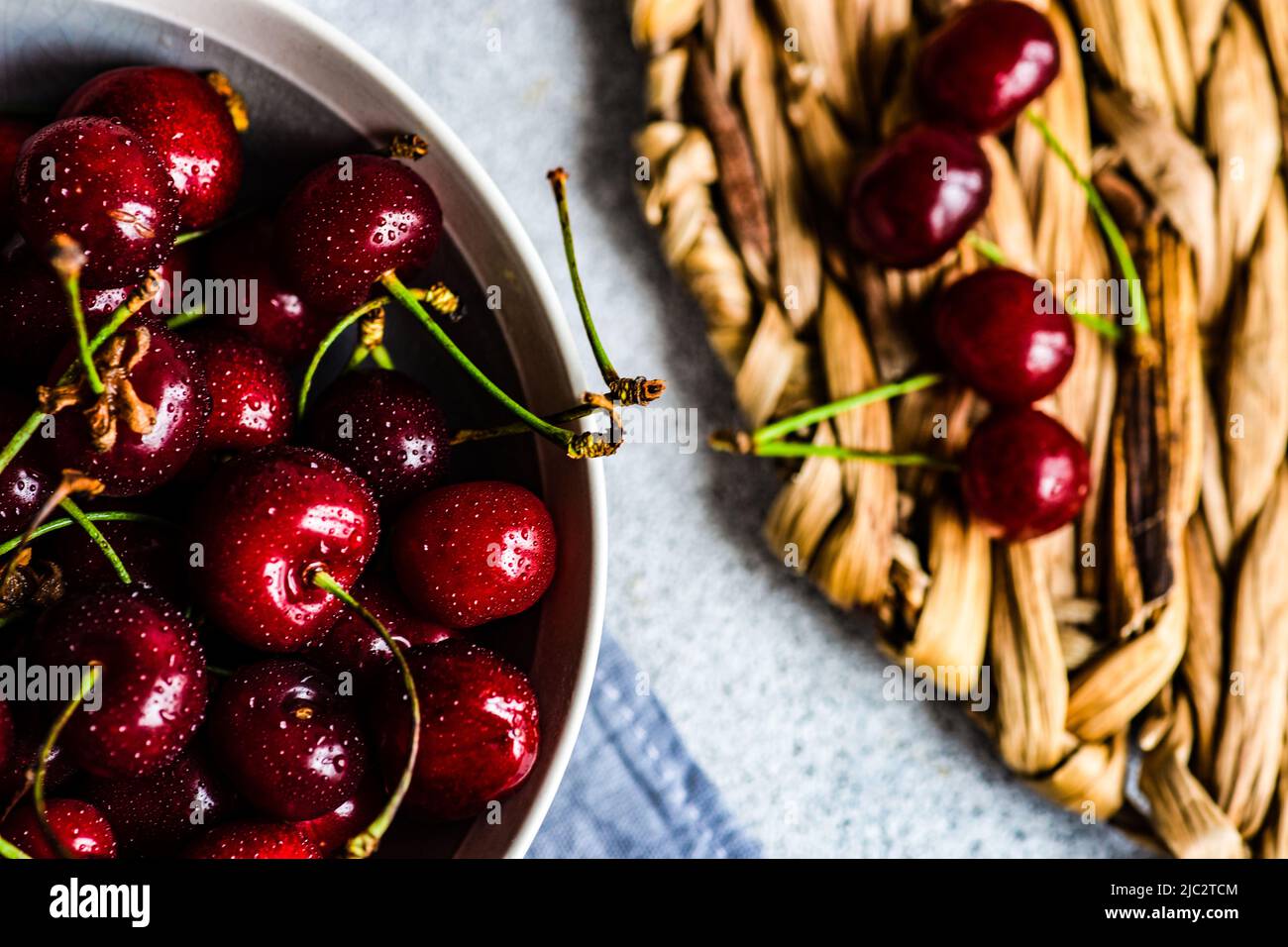 Overhead view of a bowl of organic cherries Stock Photo