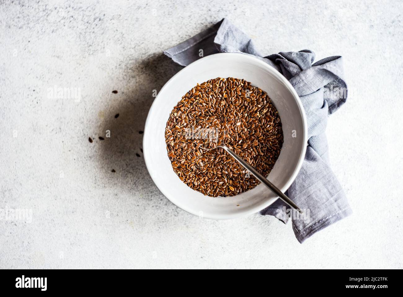 Overhead view of a bowl of organic flax seeds Stock Photo