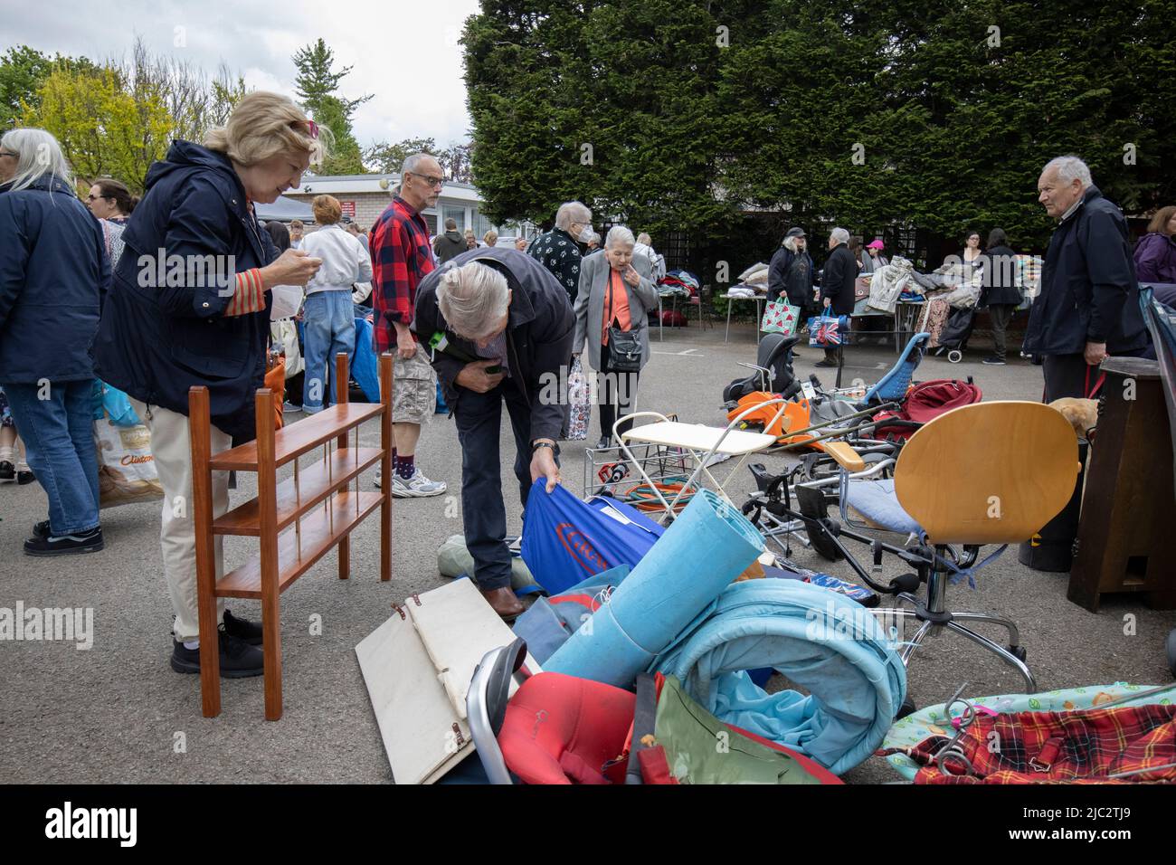 Jumble Sale, people searching through unwanted donated items and