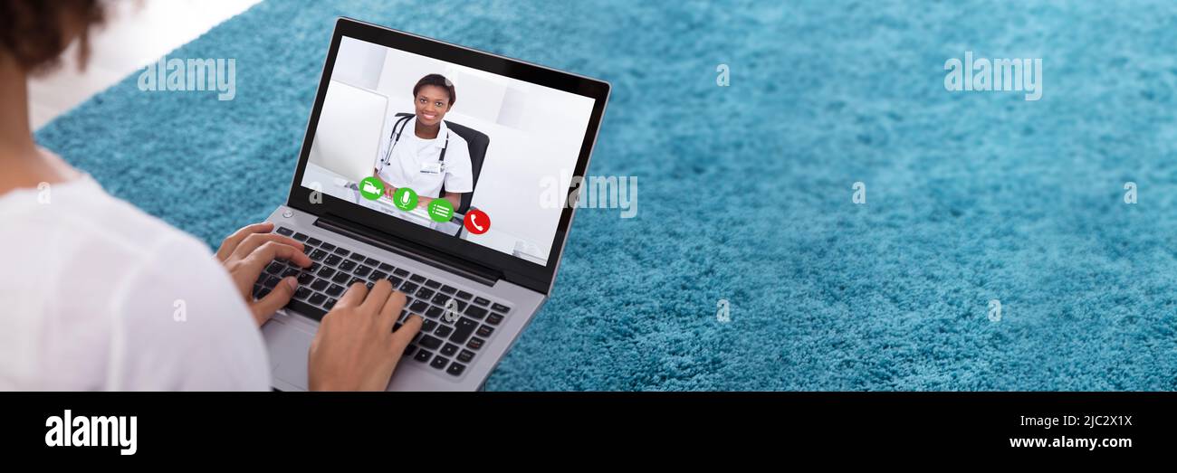Close-up Of A Woman Video Conferencing With Female Doctor On Laptop Stock Photo