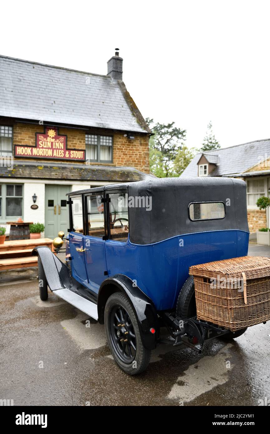 Classic Car parked at the Sun Inn Hook Norton Oxfordshire England uk