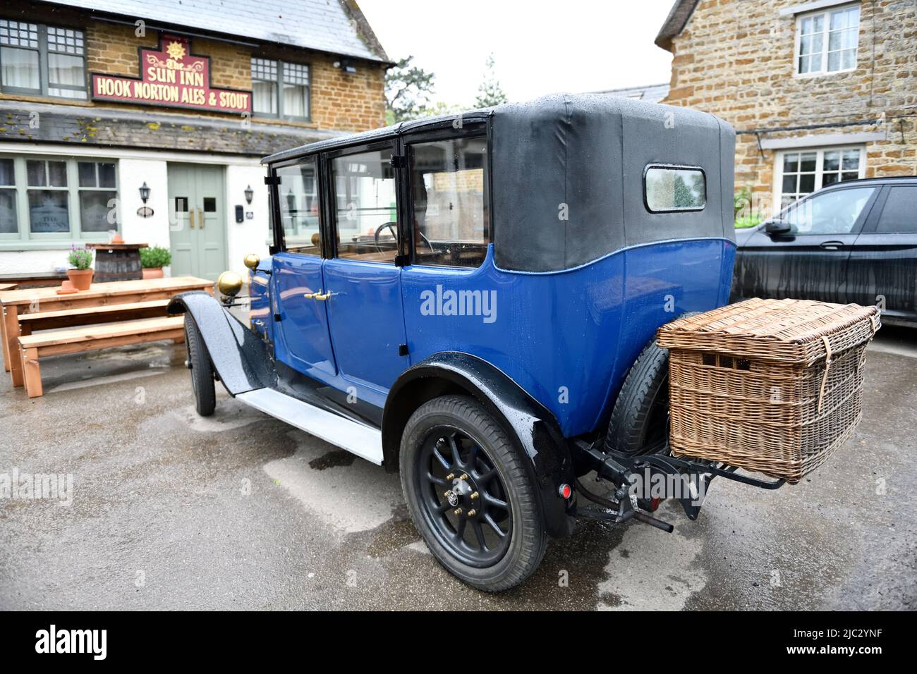 Classic Car parked at the Sun Inn Hook Norton Oxfordshire England uk