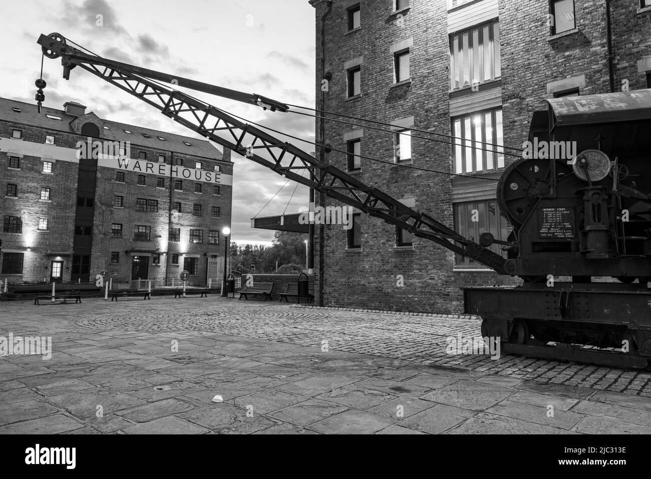 View of the old crane on the North quay Gloucester docks at dusk Stock Photo